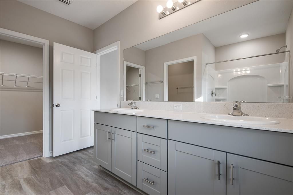 Bathroom, Dual Sink Vanities, Interior, Recessed Lighting, Walk-in Closets, Wood Texture Flooring