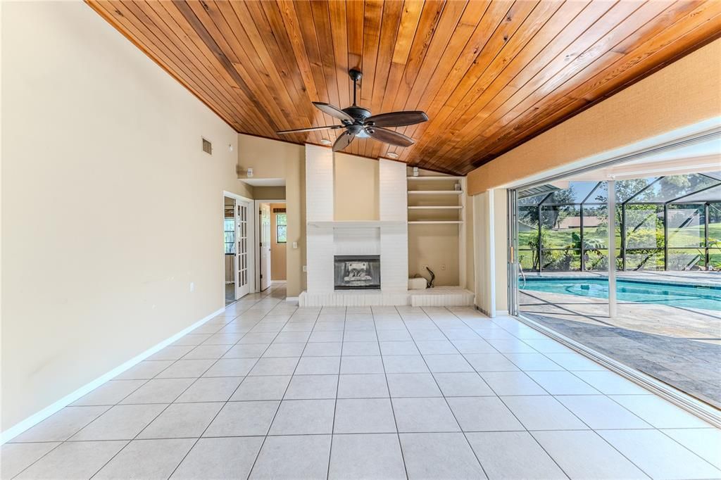 Empty room, Fireplace, Interior, Pool, Sun Room, Wooden Ceilings
