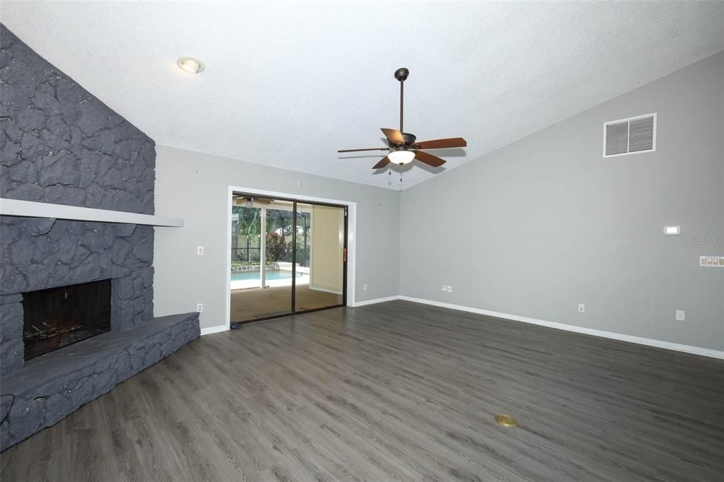 Empty room, Fireplace, Interior, Recessed Lighting, Wood Texture Flooring