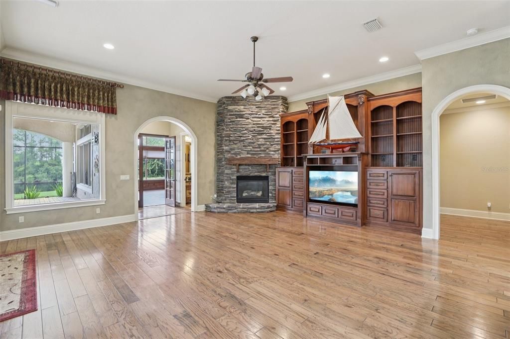 Empty room, Fireplace, Interior, Recessed Lighting, Stone Walls, Wood Texture Flooring