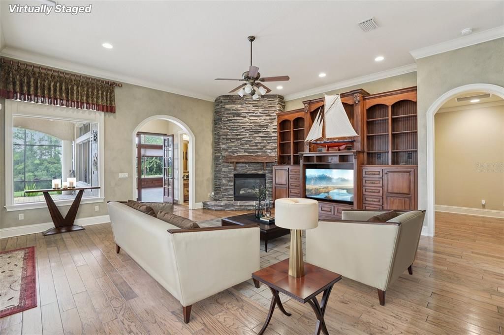 Fireplace, Interior, Living room, Recessed Lighting, Stone Walls, Wood Texture Flooring