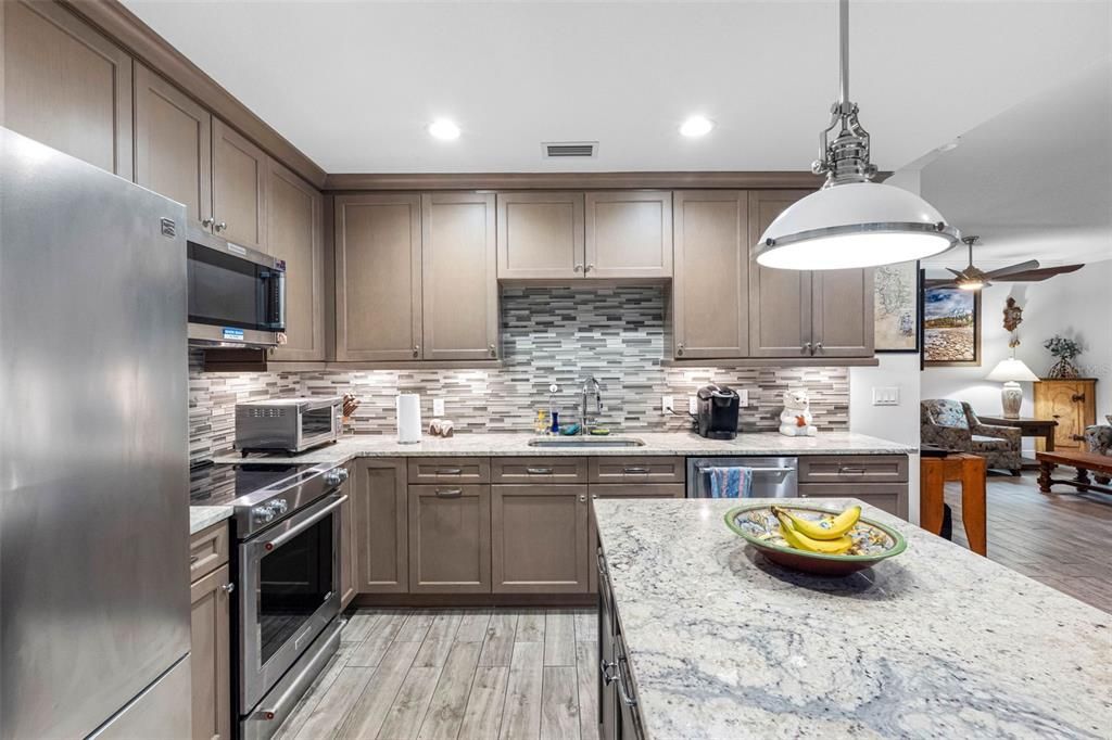 Dining room, Interior, Kitchen, Pendant Lights, Recessed Lighting, Stainless Steel Appliances, Wood Texture Flooring