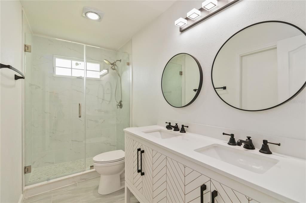 Bathroom, Dual Sink Vanities, Glass Shower, Interior, Marble Walls, Recessed Lighting