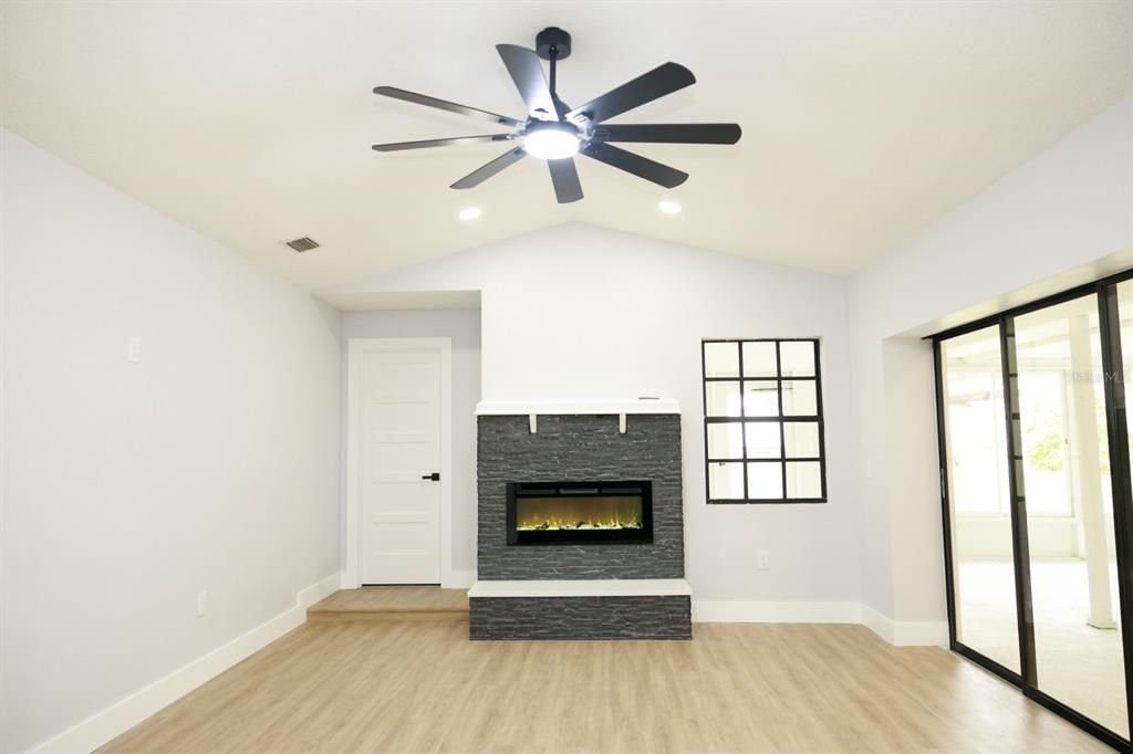 Empty room, Fireplace, Interior, Recessed Lighting, Wood Texture Flooring