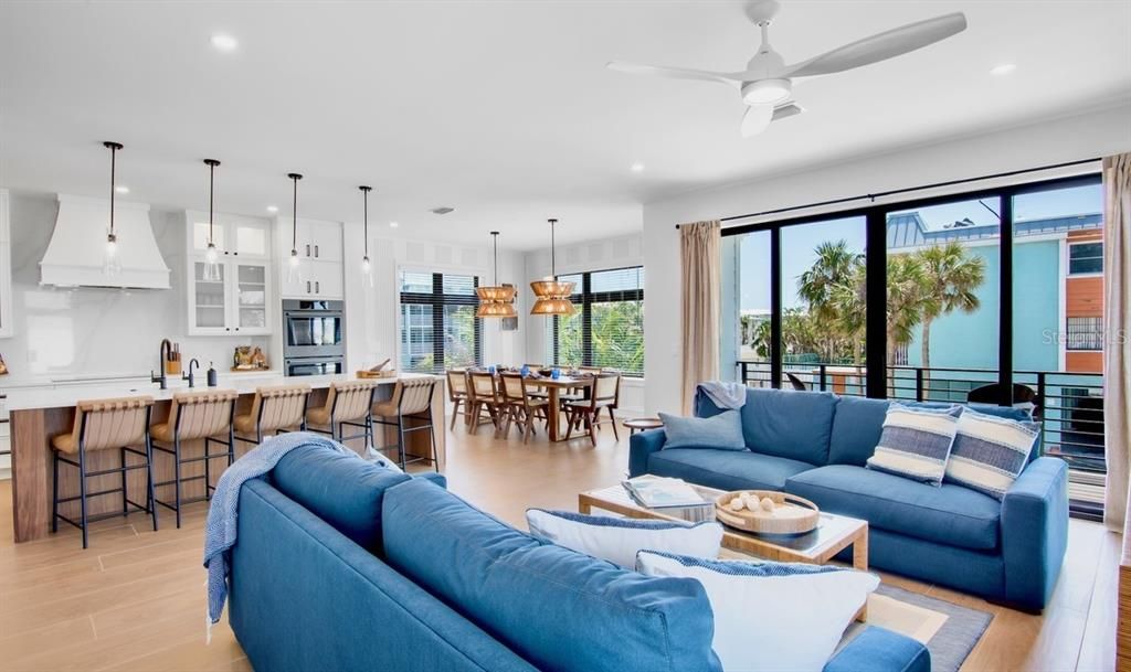 Dining room, Interior, Kitchen, Living room, Pendant Lights, Recessed Lighting, Stainless Steel Appliances, Wood Texture Flooring