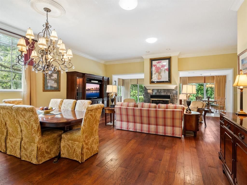Chandelier, Dining room, Fireplace, Interior, Living room, Recessed Lighting, Wood Texture Flooring