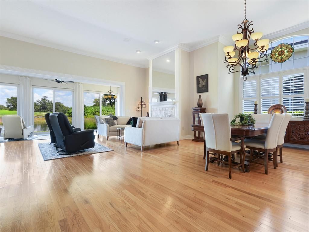 Chandelier, Dining room, Fireplace, Interior, Living room, Recessed Lighting, Wood Texture Flooring
