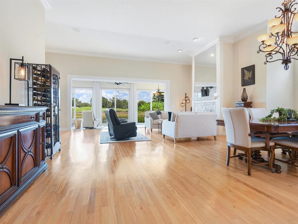 Chandelier, Dining room, Fireplace, Interior, Living room, Recessed Lighting, Wood Texture Flooring