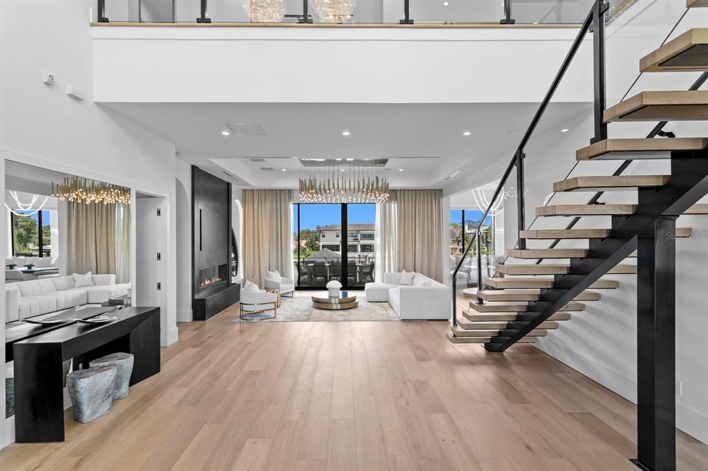 Chandelier, Fireplace, Interior, Living room, Recessed Lighting, Wood Texture Flooring