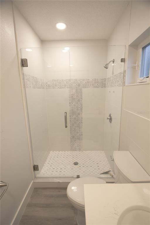Bathroom, Glass Shower, Interior, Recessed Lighting, Wood Texture Flooring