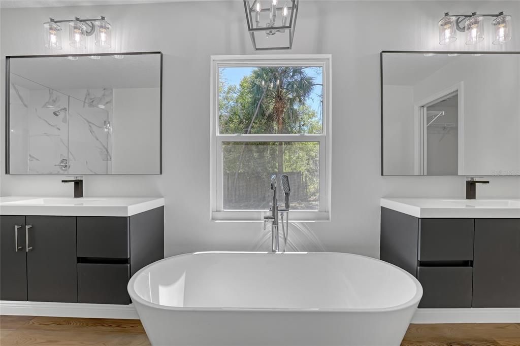 Bathroom, Dual Sink Vanities, Free Standing Baths, Interior, Marble Walls, Wood Texture Flooring
