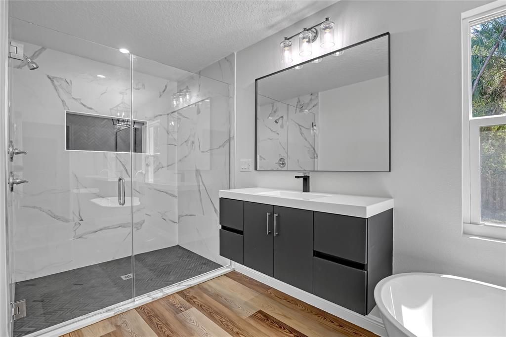 Bathroom, Glass Shower, Interior, Marble Walls, Recessed Lighting, Wood Texture Flooring