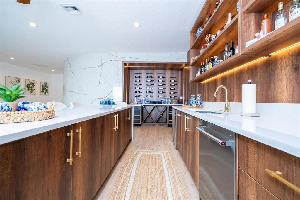 Interior, Kitchen, Marble Walls, Recessed Lighting, Stainless Steel Appliances, Wood Texture Flooring