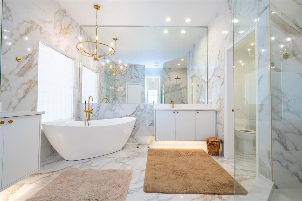Bathroom, Free Standing Baths, Glass Shower, Interior, Marble, Marble Walls, Pendant Lights, Recessed Lighting