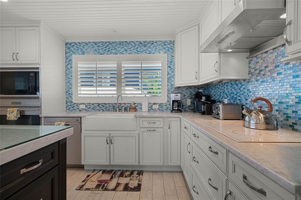 Interior, Kitchen, Recessed Lighting, Tile Countertops, Wood Texture Flooring