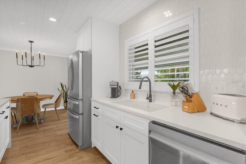 Dining room, Interior, Kitchen, Pendant Lights, Recessed Lighting, Stainless Steel Appliances, Wood Texture Flooring