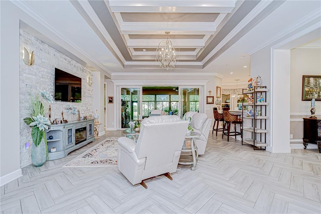Chandelier, Dining room, Interior, Living room, Pendant Lights, Recessed Lighting, Stone Walls, Wood Texture Flooring