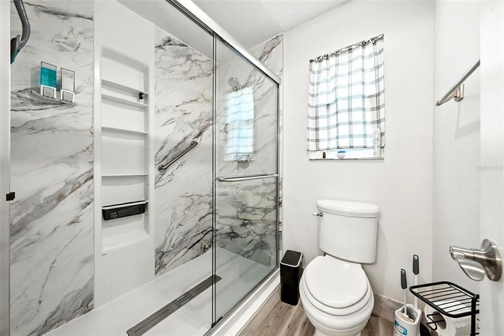 Bathroom, Glass Shower, Interior, Marble Walls, Wood Texture Flooring