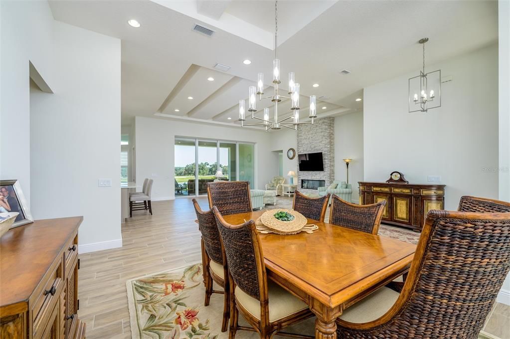 Chandelier, Dining room, Fireplace, Interior, Pendant Lights, Recessed Lighting, Wood Texture Flooring