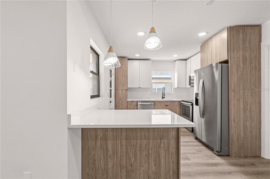 Interior, Kitchen, Pendant Lights, Recessed Lighting, Stainless Steel Appliances, Wood Texture Flooring