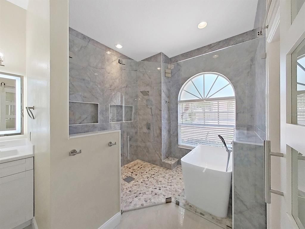 Bathroom, Free Standing Baths, Glass Shower, Interior, Marble Walls, Recessed Lighting