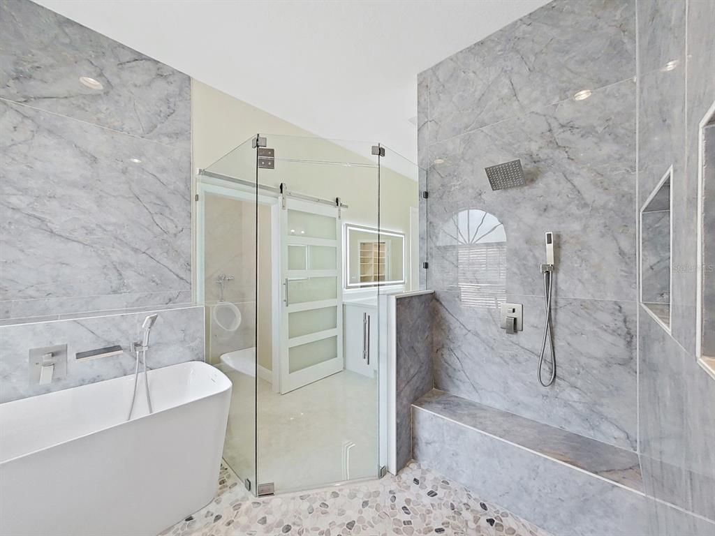 Bathroom, Free Standing Baths, Glass Shower, Interior, Marble Walls, Recessed Lighting