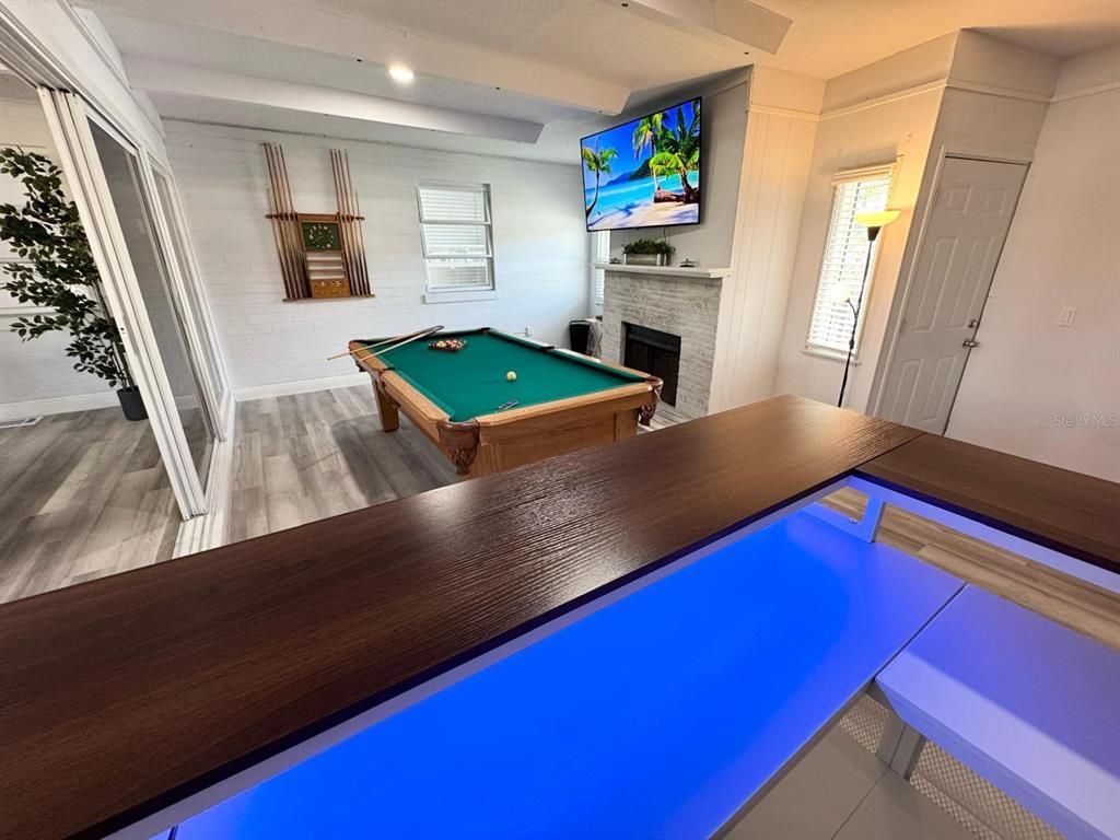 Billiard Table, Fireplace, Game Room, Interior, Pool, Recessed Lighting, Wood Texture Flooring