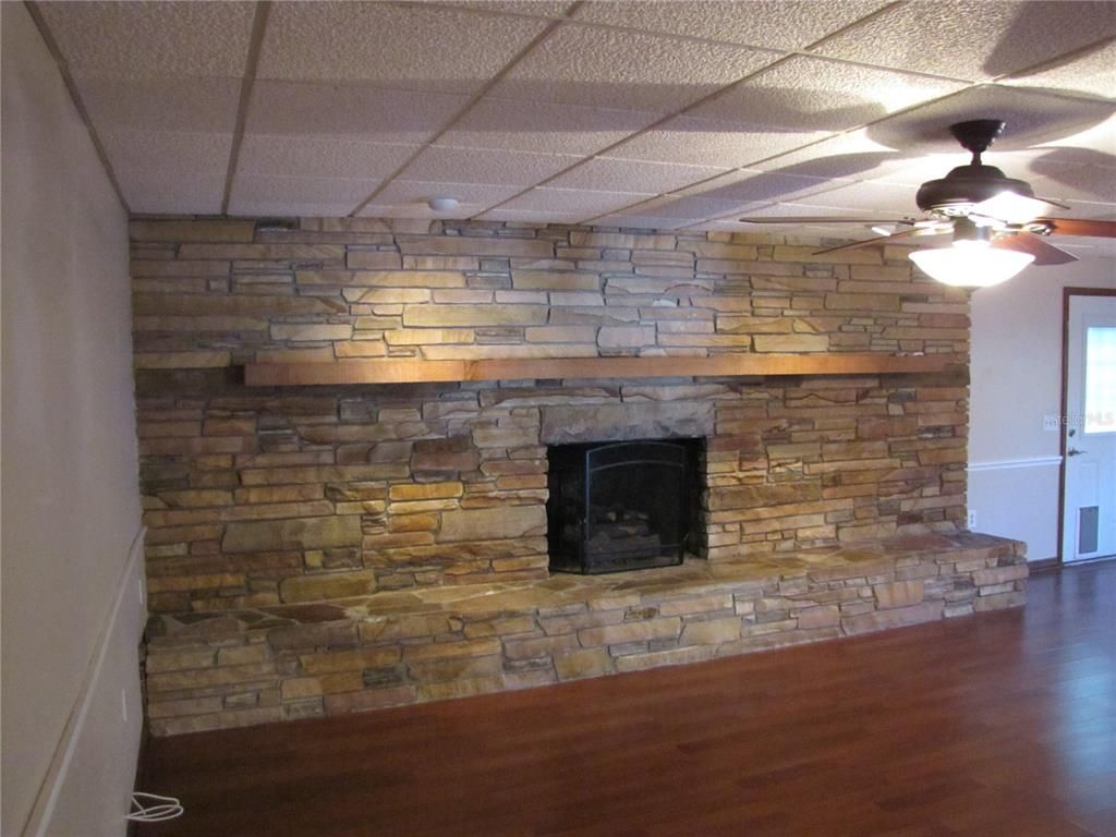 Empty room, Fireplace, Interior, Stone Walls, Wood Texture Flooring