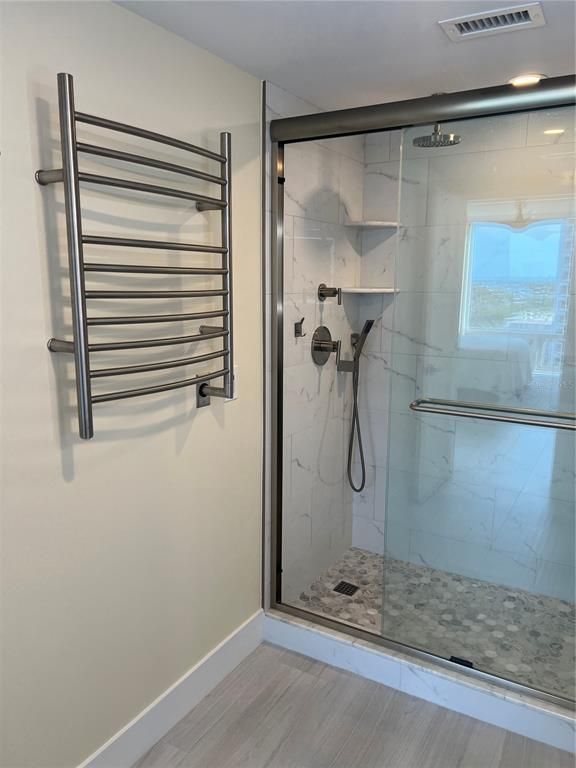 Bathroom, Glass Shower, Interior, Marble Walls, Recessed Lighting, Wood Texture Flooring