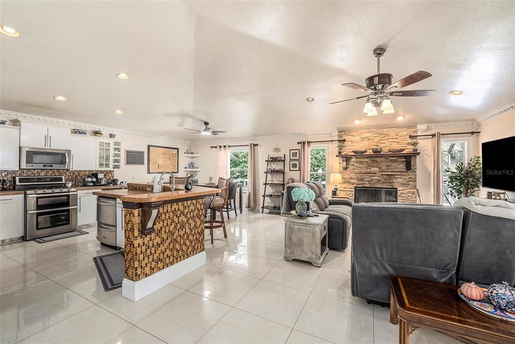Dining room, Fireplace, Interior, Kitchen, Living room, Recessed Lighting, Stone Walls