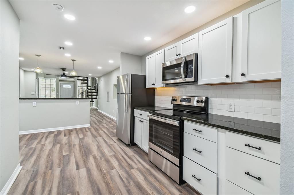 Interior, Kitchen, Pendant Lights, Recessed Lighting, Stainless Steel Appliances, Wood Texture Flooring