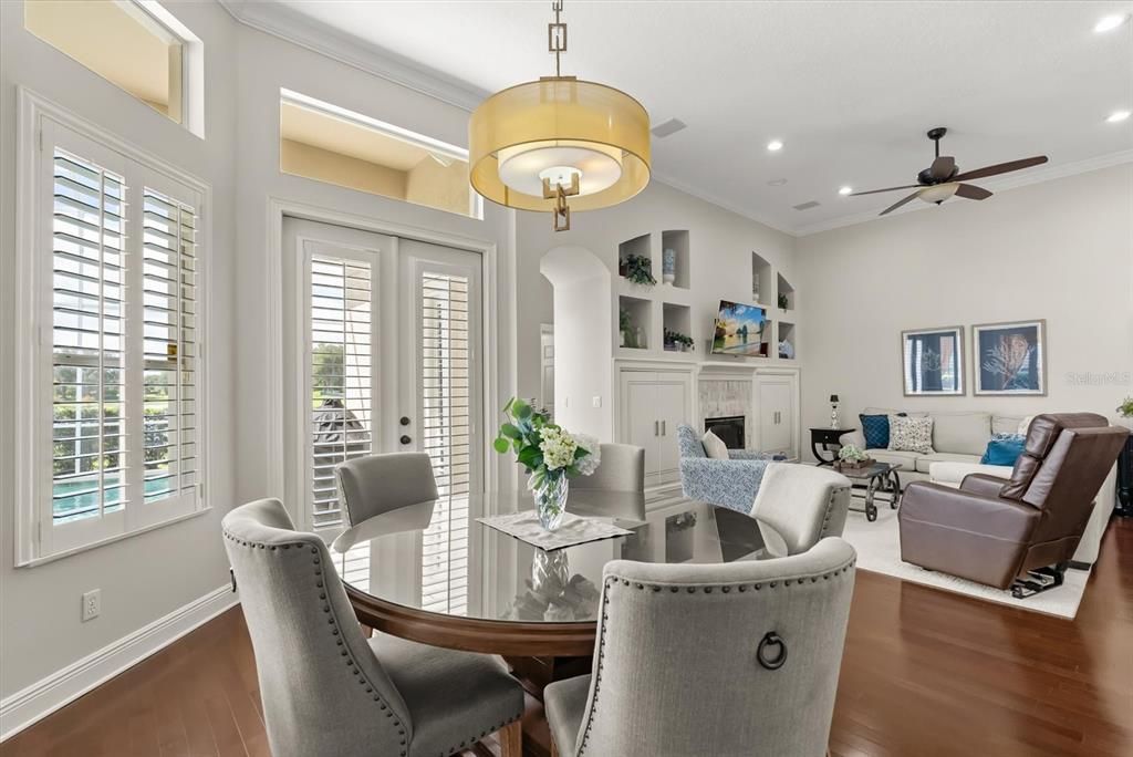 Dining room, Fireplace, Interior, Living room, Pendant Lights, Recessed Lighting, Wood Texture Flooring