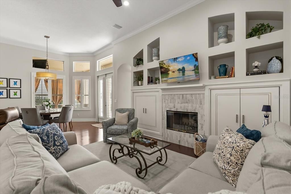 Dining room, Fireplace, Interior, Living room, Pendant Lights, Recessed Lighting, Wood Texture Flooring