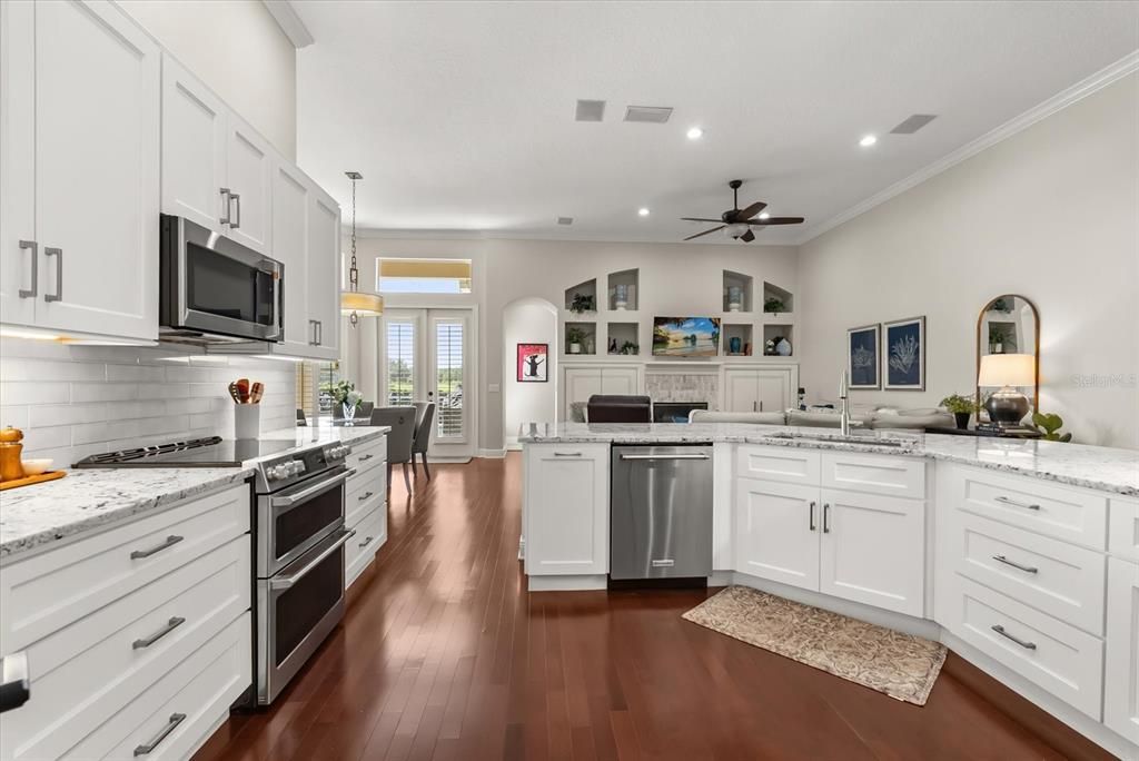 Dining room, Interior, Kitchen, Pendant Lights, Recessed Lighting, Stainless Steel Appliances, Wood Texture Flooring