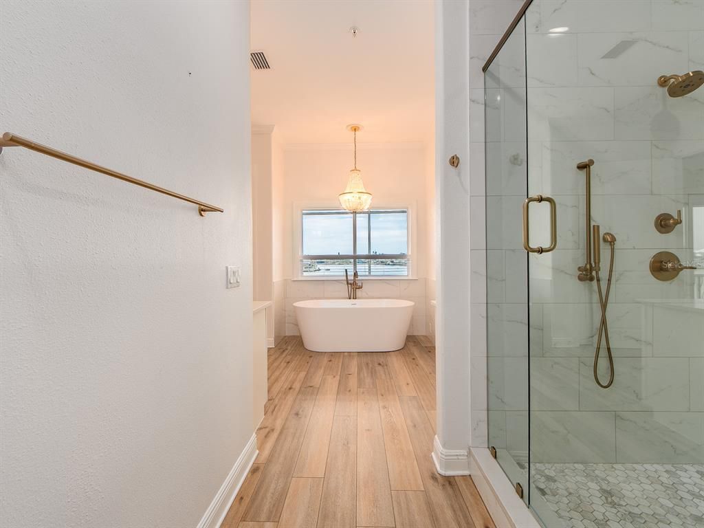 Bathroom, Free Standing Baths, Glass Shower, Interior, Marble Walls, Pendant Lights, Wood Texture Flooring