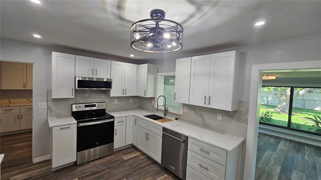 Interior, Kitchen, Recessed Lighting, Stainless Steel Appliances, Wood Texture Flooring