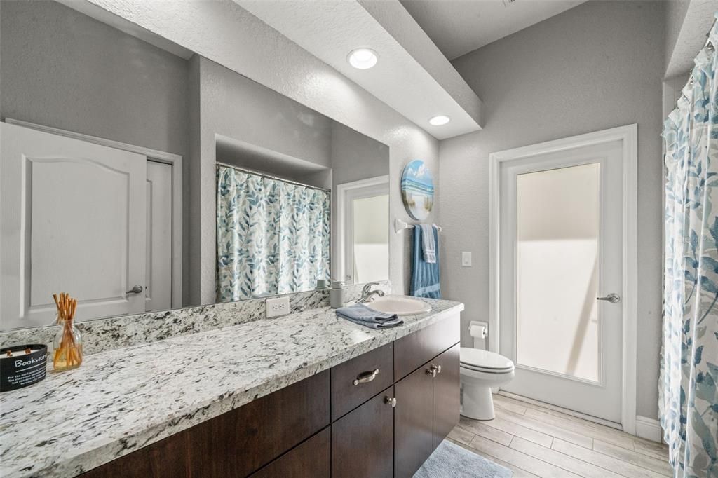 Bathroom, Dual Sink Vanities, Interior, Recessed Lighting, Wood Texture Flooring