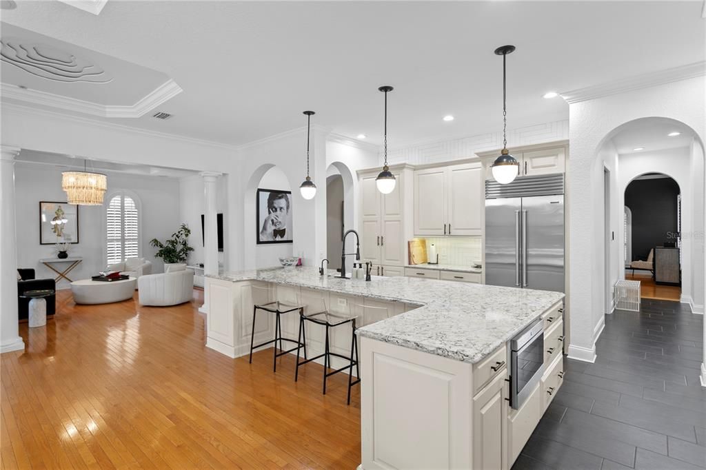 Chandelier, Interior, Kitchen, Living room, Pendant Lights, Recessed Lighting, Stainless Steel Appliances, Wood Texture Flooring