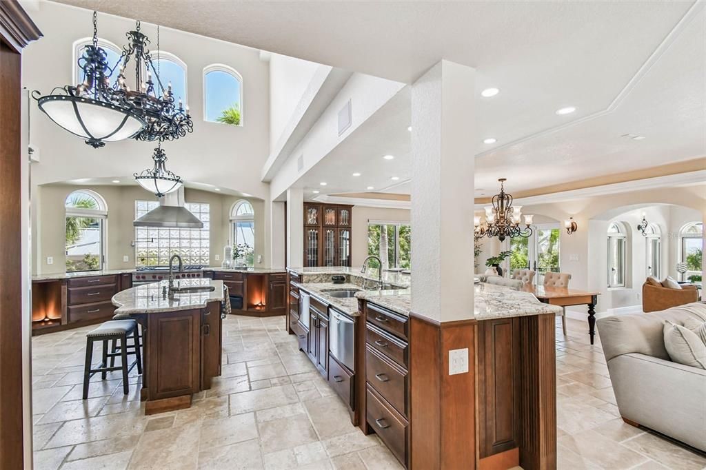 Chandelier, Dining room, Fireplace, Interior, Kitchen, Living room, Recessed Lighting, Stainless Steel Appliances