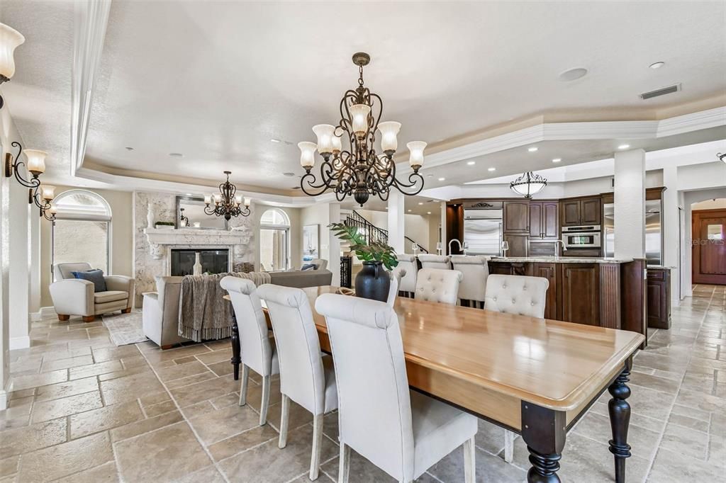 Chandelier, Dining room, Fireplace, Interior, Kitchen, Living room, Recessed Lighting, Stainless Steel Appliances