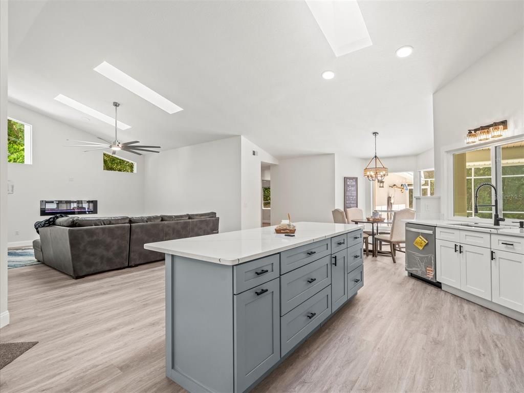 Chandelier, Dining room, Interior, Kitchen, Living room, Pendant Lights, Recessed Lighting, Wood Texture Flooring