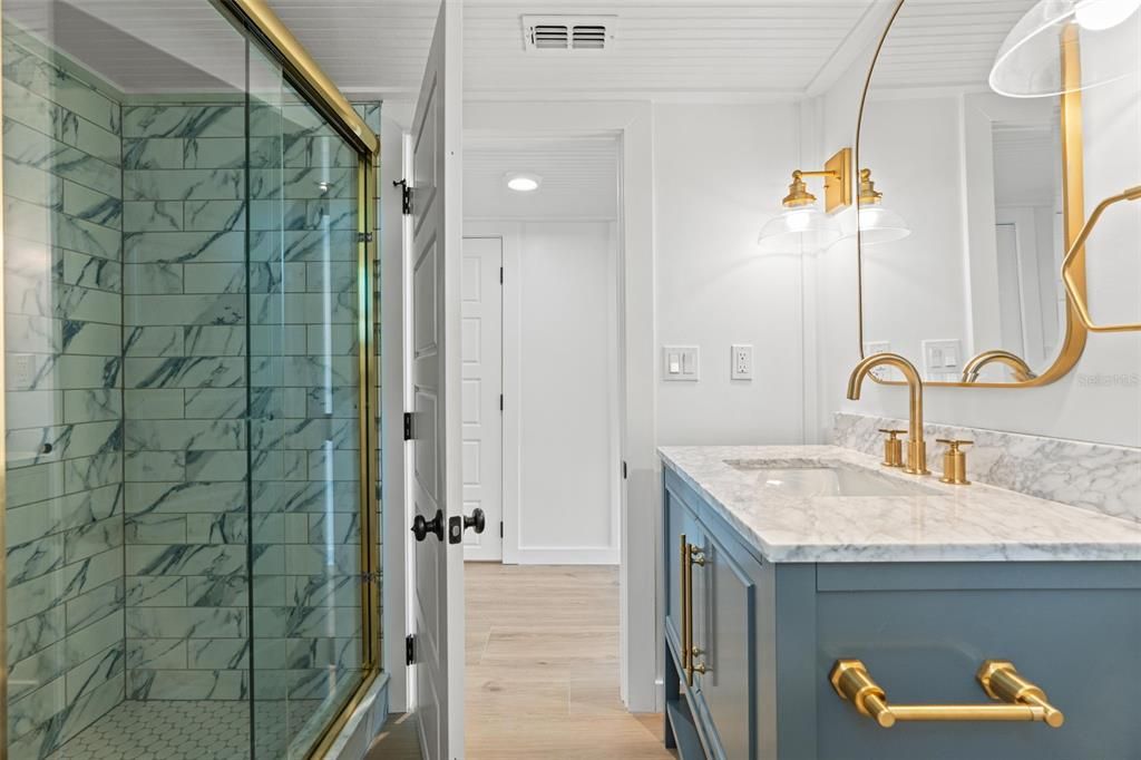 Bathroom, Dual Sink Vanities, Glass Shower, Interior, Recessed Lighting, Wood Texture Flooring