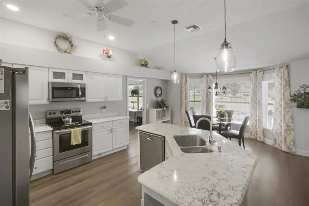 Dining room, Interior, Kitchen, Pendant Lights, Recessed Lighting, Stainless Steel Appliances, Wood Texture Flooring