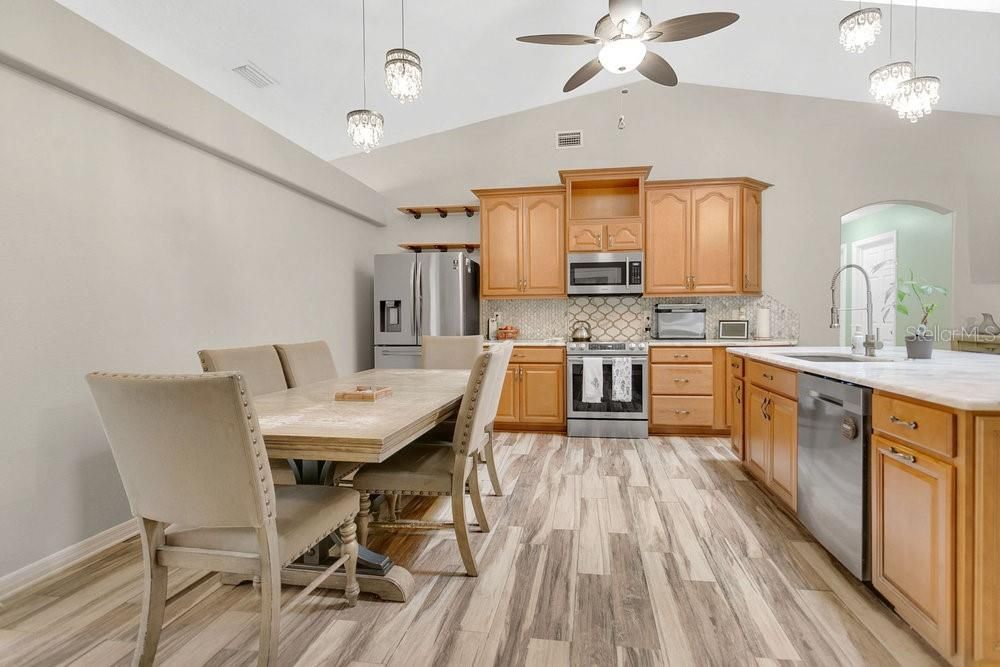 Dining room, Interior, Kitchen, Pendant Lights, Stainless Steel Appliances, Wood Texture Flooring