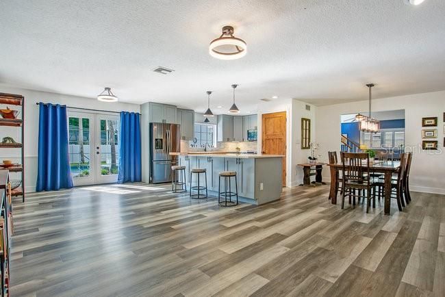 Chandelier, Dining room, Interior, Kitchen, Pendant Lights, Recessed Lighting, Stainless Steel Appliances, Wood Texture Flooring