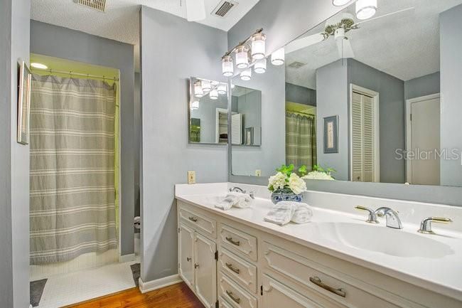 Bathroom, Dual Sink Vanities, Glass Shower, Interior, Wood Texture Flooring