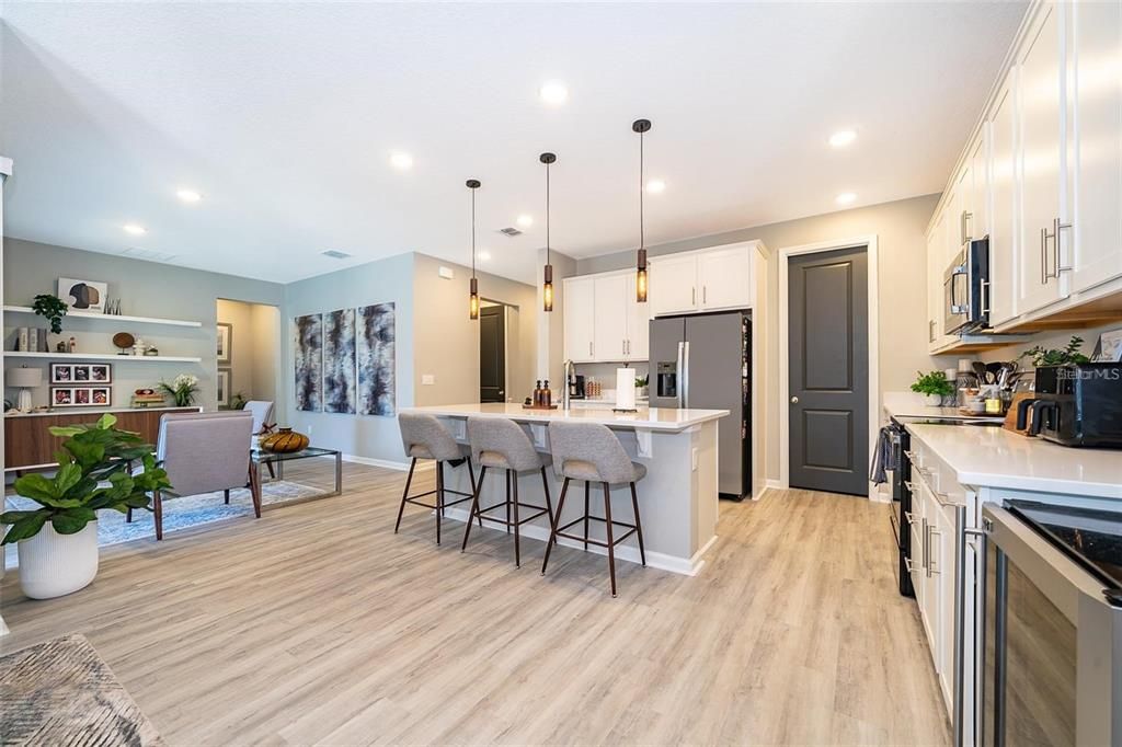 Dining room, Interior, Kitchen, Pendant Lights, Recessed Lighting, Stainless Steel Appliances, Wood Texture Flooring