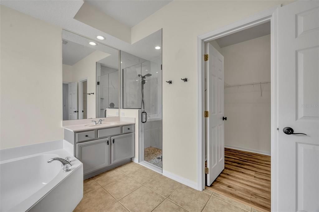 Bathroom, Dual Sink Vanities, Glass Shower, Interior, Recessed Lighting, Wood Texture Flooring