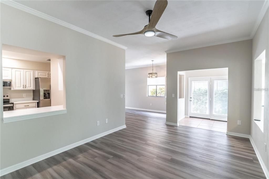 Chandelier, Empty room, Interior, Kitchen, Pendant Lights, Stainless Steel Appliances, Wood Texture Flooring
