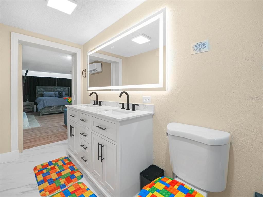 Bathroom, Bedroom, Dual Sink Vanities, Interior, Marble, Recessed Lighting, Wood Texture Flooring
